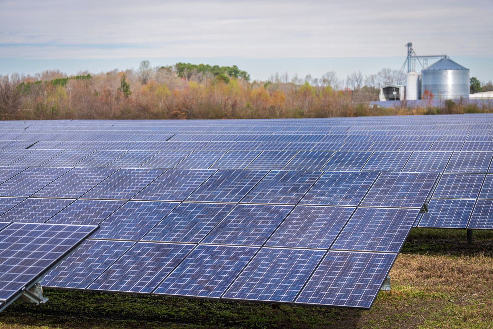 A completed ground-mount solar field with access road