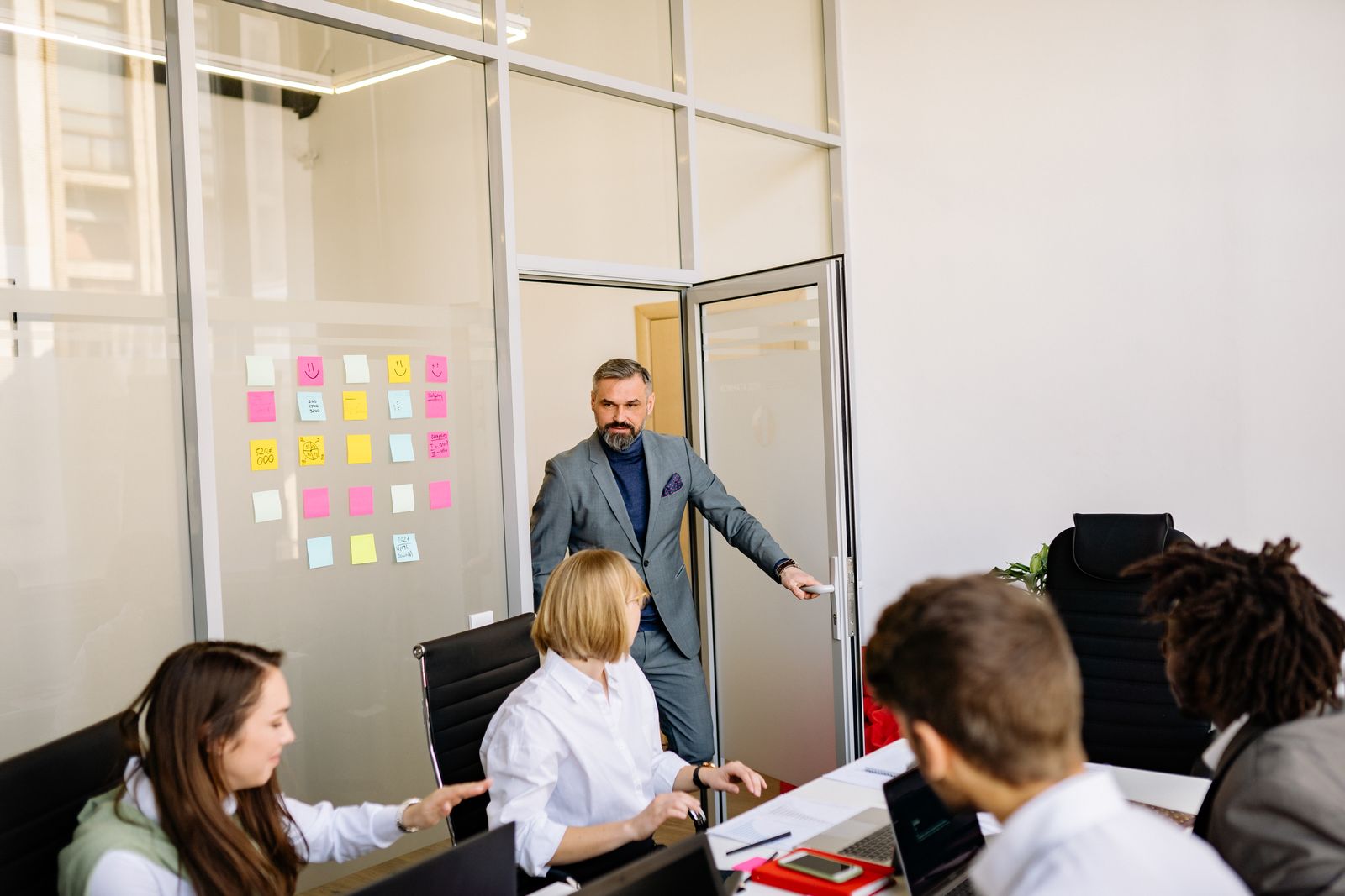 A commercial finance discussion around a meeting table